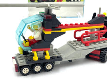 Load image into Gallery viewer, Back view of the red LEGO helicopter displaying trailer design and multiple colors.
