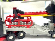 Load image into Gallery viewer, Side view of the LEGO truck showcasing the driver figure and cargo area.
