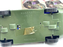 Load image into Gallery viewer, Green toy car bottom view showing wheels and base details.
