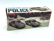 Load image into Gallery viewer, Packaging of REEL American Police POLIZIA Maserati Indy Auto with graphic design and window display.
