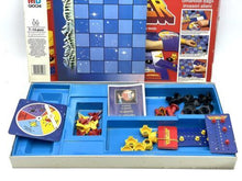 Load image into Gallery viewer, Close-up detail of MB Games Defender Board Game components including game pieces and spinner.
