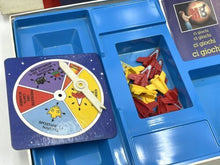 Load image into Gallery viewer, Detail view of MB Games Defender Board Game showing colorful spinner and instruction booklet.
