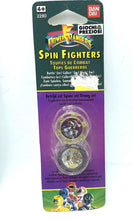 Load image into Gallery viewer, Packaging view of the 1993 Bandai Mighty Morphin Power Rangers Spin Fighters featuring two spinning tops in purple and gold.
