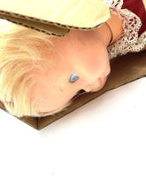Load image into Gallery viewer, Close-up of doll's smiling face with blue eyes and peach-colored skin.
