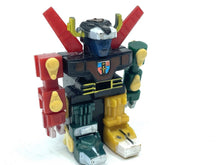Load image into Gallery viewer, Front view of the colorful 1984 mini Voltron robot with articulated limbs.
