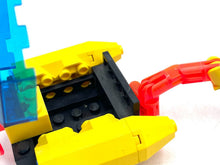 Load image into Gallery viewer, Detail view of toy submarine components including a flexible tube and block structure.
