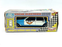 Load image into Gallery viewer, JUGUETES ROMAN COCHE ELECTRICO POLICE CAR packaging view with blue, white, and yellow colors.
