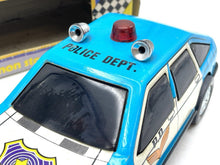 Load image into Gallery viewer, JUGUETES ROMAN COCHE ELECTRICO POLICE CAR top detail view featuring light bar and roof details.
