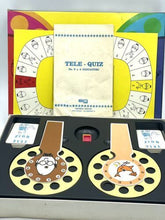 Load image into Gallery viewer, VINTAGE TELEQUIZ color wheel set with two wheels and instruction booklet on black base.
