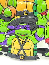 Carica l'immagine nel visualizzatore di Gallery, Playmates TMNT vintage store display detail close-up of a character with a mask and colorful design.
