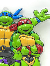 Carica l'immagine nel visualizzatore di Gallery, Playmates TMNT vintage store display detail close-up showing two characters with smiling faces and colorful masks.
