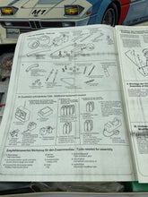 Load image into Gallery viewer, Detail view of instruction manual for Revell BMW M1 Turbo radio-controlled car.
