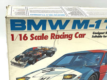 Load image into Gallery viewer, Revell BMW M1 Turbo radio-controlled car side view displaying sponsor logos.
