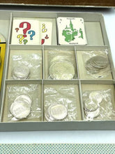 Load image into Gallery viewer, Close-up of the game pieces showing various shapes and organized layout
