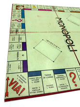 Load image into Gallery viewer, Side view of the Monopoli game board showcasing property spaces and layout.
