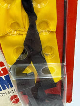Load image into Gallery viewer, Close-up of nunchaku and black outfit from Big Jim Kung Fu Set.
