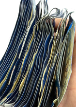 Load image into Gallery viewer, Close-up of a stack of Star Wars trading cards with blue and gold colors.
