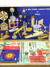 Load image into Gallery viewer, Packaging of the physics laboratory kit contents displaying various tools and educational materials.
