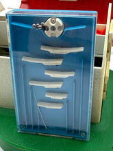 Load image into Gallery viewer, Detail of a blue storage box with a transparent lid and compartments.
