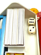 Load image into Gallery viewer, Close-up of two dice and a stack of cards.
