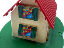 Load image into Gallery viewer, Side view of the wooden toy house featuring a red roof and colorful shutters.
