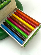 Load image into Gallery viewer, Close-up of eight colored crayons in blue, green, yellow, and red on a white background.
