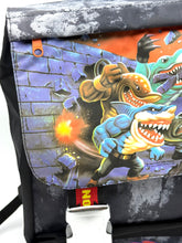 Load image into Gallery viewer, Collection view of various Street Sharks backpacks from the 90s.
