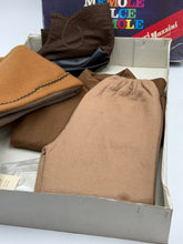Load image into Gallery viewer, Lifestyle shot of fabric pieces inside the box with colorful packaging.
