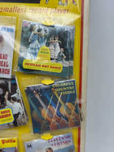 Load image into Gallery viewer, Various music albums displayed with colorful covers in a hanging display
