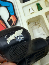 Carica l'immagine nel visualizzatore di Gallery, Clementoni Far West Gringo! damaged black toy gun with visible surface wear in detail close-up view.
