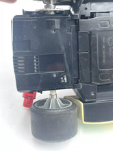 Load image into Gallery viewer, Detail close-up of the black toy car showing visible wheel and undercarriage.
