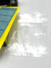 Load image into Gallery viewer, Detail view of game components including instructions and plastic sheet
