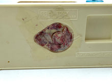 Load image into Gallery viewer, Detail of the toy base with textured surface
