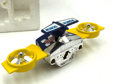 Load image into Gallery viewer, Detail view of toy helicopter with rotating blades and intricate design.
