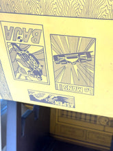 Load image into Gallery viewer, Close-up of printed graphics and text descriptions inside the Mattel Big Jim Sports Camper.
