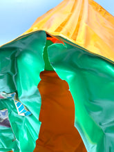 Load image into Gallery viewer, Mattel Big Jim Camping Tent detail close-up of colorful bag with crinkled texture and zipper opening
