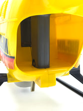 Load image into Gallery viewer, Interior view of the yellow helicopter showing open compartment and visible structure.
