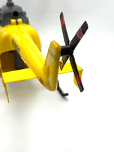 Load image into Gallery viewer, Exterior view of the yellow helicopter highlighting rotor blades and tail fin.
