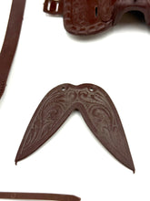 Load image into Gallery viewer, Close-up of a uniquely shaped brown leather piece.
