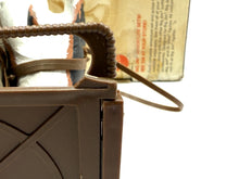 Load image into Gallery viewer, Detail close-up of the sled interior slats and handle.

