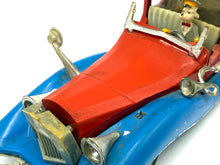 Load image into Gallery viewer, Close-up of Politoys M559 Uncle Scrooge Car showing missing parts and restoration needs.
