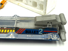 Carica l'immagine nel visualizzatore di Gallery, Detail view of the gray and blue toy spaceship showing control panel and label 'Pilot 2'.
