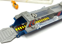 Carica l'immagine nel visualizzatore di Gallery, Detail view of the gray and blue toy spaceship with open hatch and interior.
