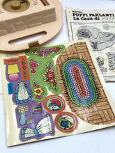 Carica l'immagine nel visualizzatore di Gallery, Detail of the colorful play mat with various shapes and interactive elements

