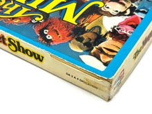 Carica l'immagine nel visualizzatore di Gallery, Side view of The Muppet Show board game box edge featuring character illustrations.
