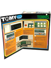 Load image into Gallery viewer, Tomy Tennis game box back with instruction details and colorful layout.
