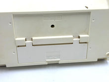Load image into Gallery viewer, Detail close-up of vintage gaming console back panel with cartridge slot.
