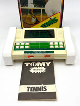 Load image into Gallery viewer, Vintage gaming console packaging with game cartridge and screen display.
