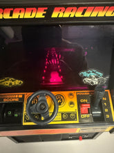 Load image into Gallery viewer, Detail close-up of the arcade racing machine showing steering wheel and control panel.
