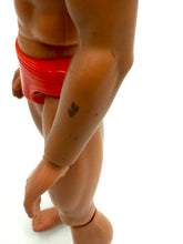 Load image into Gallery viewer, Side view of Mattel Big Jim Karate action figure showcasing muscular build in swim trunks.
